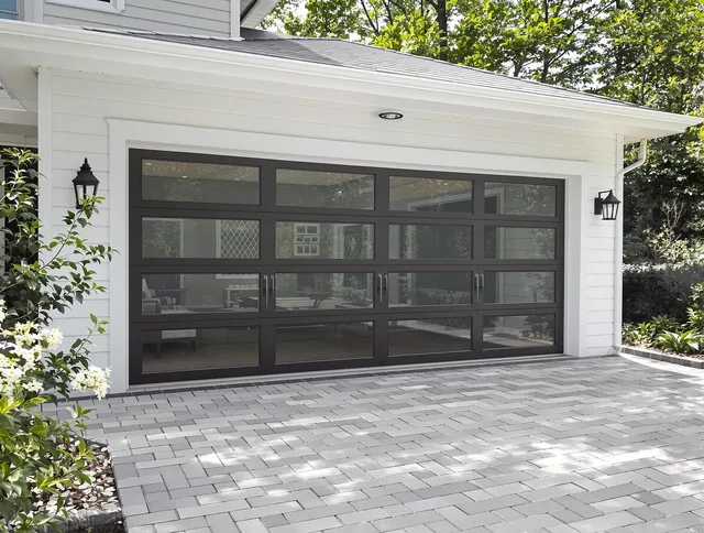 Plymouth Garage Door Repair design specialist presenting custom garage door options to Plymouth homeowner