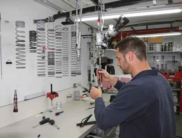 Plymouth Garage Door Repair safety certified technician performing precision spring replacement in Plymouth